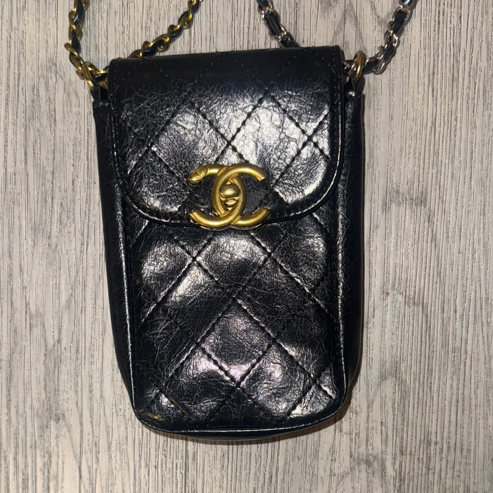 CHANEL Black Quilted Mini Bag with Gold Accents
